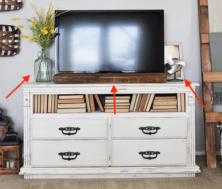 tv console with line of sight blocked by decorative items
